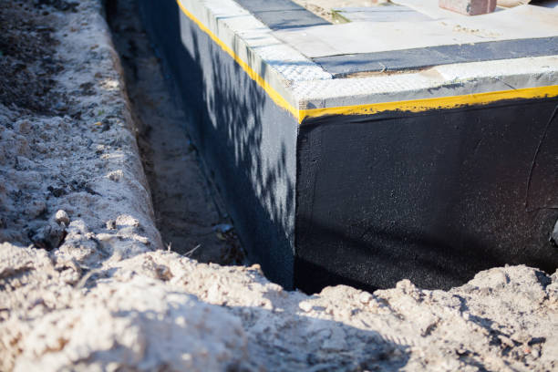 Professional Emergency Waterproofing technician working in Amherst, WI